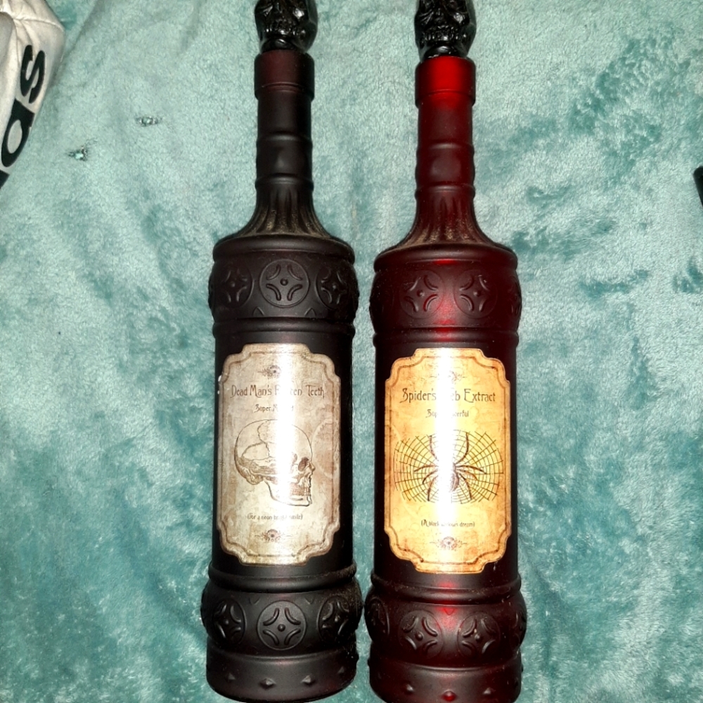 Decorative bottles,two of them,with witchcraft recipe on them